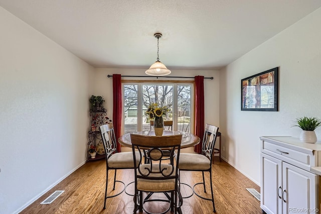2556 E 131st Pl, Thornton, CO 80241 - dining room featuring light wood finished floors and baseboards