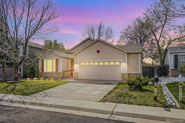 2556 E 131st Pl, Thornton, CO 80241 - view of front of property with concrete driveway, an attached garage, stone siding, and brick siding