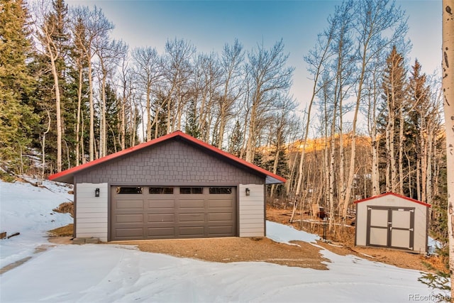 2150 Michigan Hill Rd, Jefferson, CO 80456 - snow covered garage featuring a garage