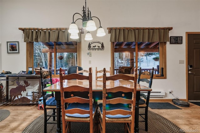 2150 Michigan Hill Rd, Jefferson, CO 80456 - dining space with a chandelier and wood finished floors