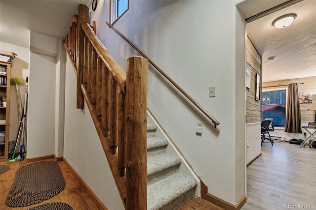 2150 Michigan Hill Rd, Jefferson, CO 80456 - staircase with wood finished floors, baseboards, and a textured wall