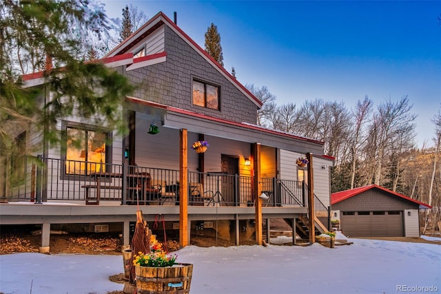 2150 Michigan Hill Rd, Jefferson, CO 80456 - view of front of property with a porch, a detached garage, stairway, and an outbuilding