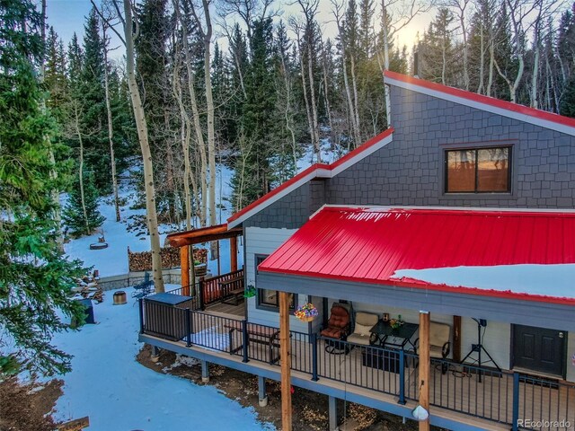 2150 Michigan Hill Rd, Jefferson, CO 80456 - rear view of house with a wooden deck and metal roof