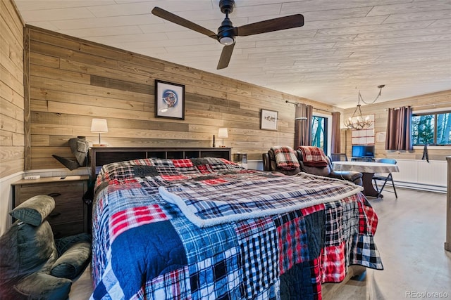 2150 Michigan Hill Rd, Jefferson, CO 80456 - bedroom with baseboard heating, wooden walls, a chandelier, concrete floors, and a ceiling fan