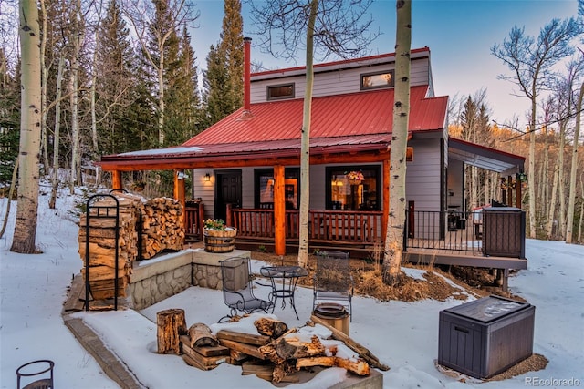 2150 Michigan Hill Rd, Jefferson, CO 80456 - snow covered house with covered porch and metal roof