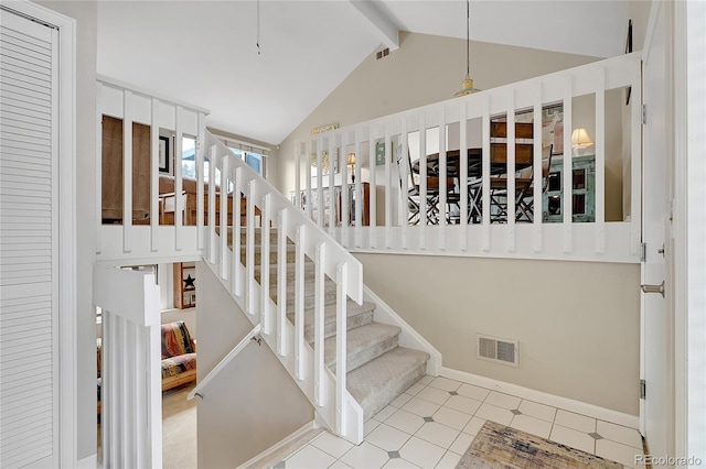 staircase with baseboards, high vaulted ceiling, beam ceiling, and visible vents