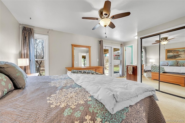 bedroom featuring access to outside, a ceiling fan, and carpet