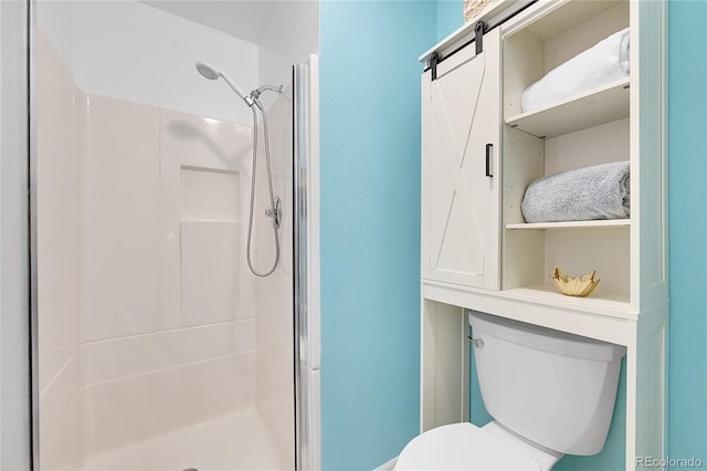 bathroom featuring a shower stall and toilet