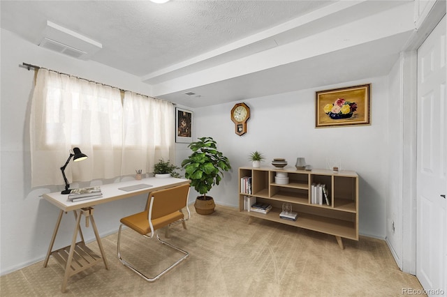 home office with light carpet, baseboards, visible vents, and a textured ceiling