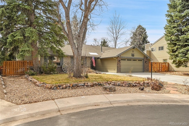 ranch-style house with roof with shingles, fence, brick siding, an attached garage, and driveway