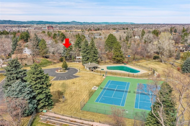 birds eye view of property with a mountain view