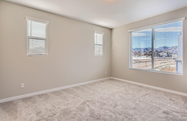 9629 Browns Peak Cir, Littleton, CO 80125 - carpeted spare room featuring baseboards