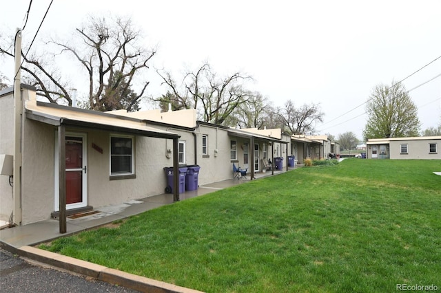 view of home's exterior featuring a yard