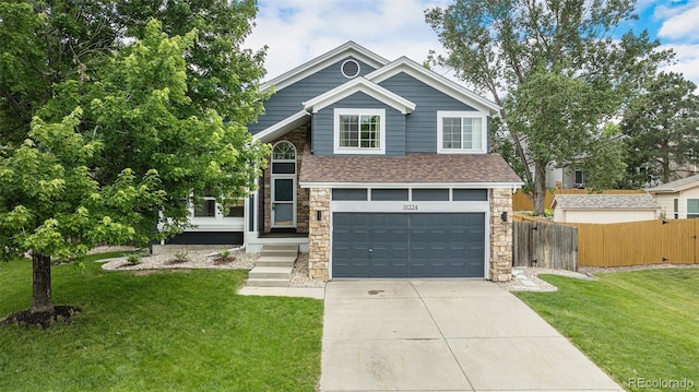19334 E Prentice Pl, Centennial, CO 80015 - view of front of home with an attached garage, concrete driveway, stone siding, and roof with shingles