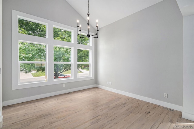 19334 E Prentice Pl, Centennial, CO 80015 - spare room featuring a chandelier, light wood finished floors, and high vaulted ceiling