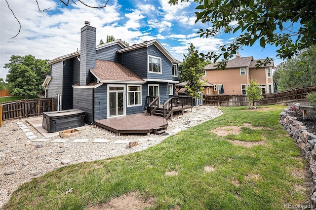 19334 E Prentice Pl, Centennial, CO 80015 - rear view of house featuring a hot tub, a fenced backyard, a deck, a chimney, and a shingled roof