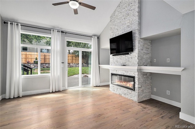 19334 E Prentice Pl, Centennial, CO 80015 - unfurnished living room featuring a fireplace, lofted ceiling, ceiling fan, and wood finished floors