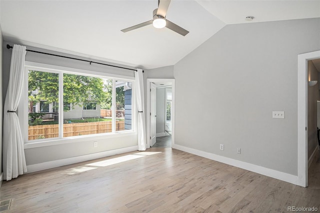 19334 E Prentice Pl, Centennial, CO 80015 - spare room with vaulted ceiling, ceiling fan, wood finished floors, and a smoke detector