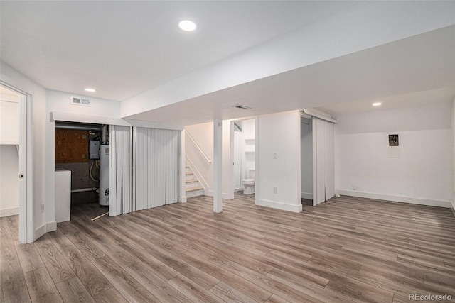 19334 E Prentice Pl, Centennial, CO 80015 - finished below grade area with light wood-type flooring, stairs, gas water heater, and recessed lighting