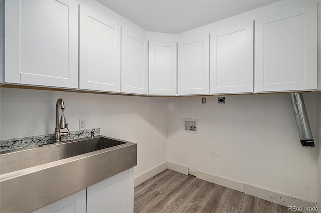19334 E Prentice Pl, Centennial, CO 80015 - laundry area with cabinet space, washer hookup, light wood finished floors, and hookup for an electric dryer