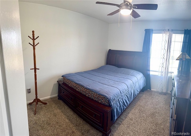 bedroom with carpet floors, a ceiling fan, and baseboards