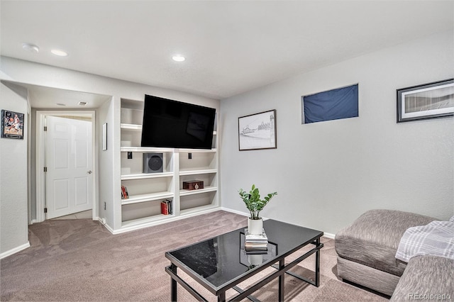 living room with recessed lighting, baseboards, and carpet