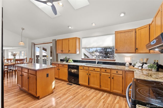 kitchen featuring vaulted ceiling with skylight, pendant lighting, sink, black dishwasher, and range with electric stovetop