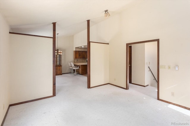 unfurnished room with baseboards and light colored carpet