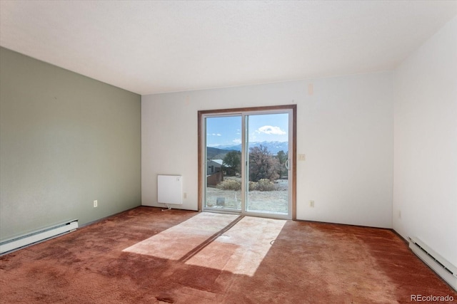 carpeted empty room with baseboard heating