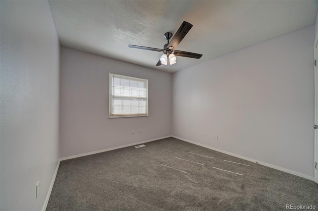 carpeted empty room featuring ceiling fan