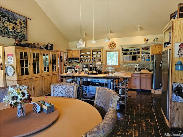 dining space with vaulted ceiling