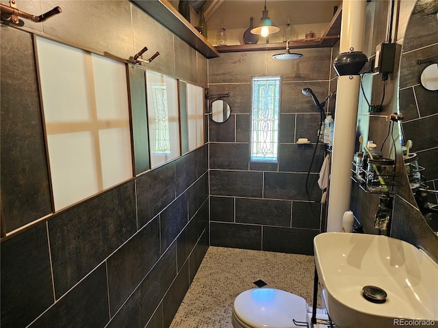 bathroom with tiled shower and toilet