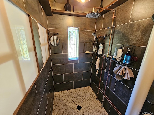 bathroom with a tile shower