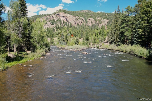 property view of mountains featuring a water view