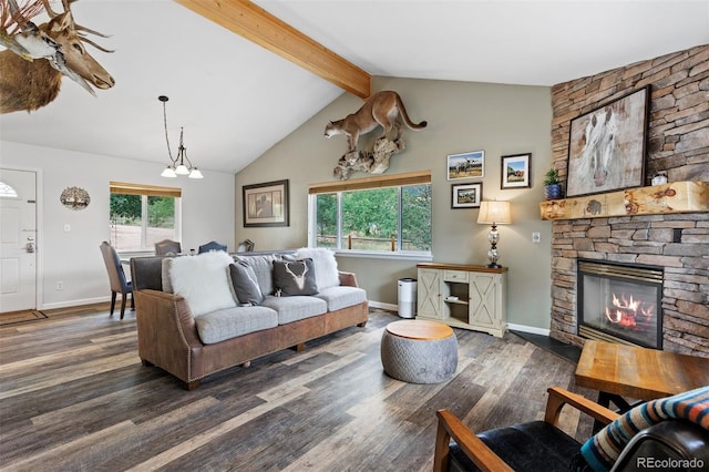 living room featuring dark hardwood / wood-style flooring, a notable chandelier, a fireplace, and lofted ceiling with beams