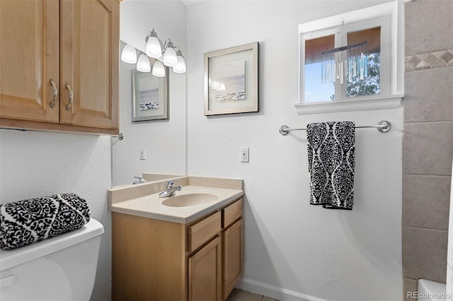 bathroom with vanity and toilet