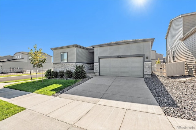 view of front of property with a front lawn and a garage