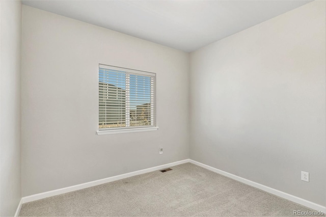 spare room featuring carpet floors