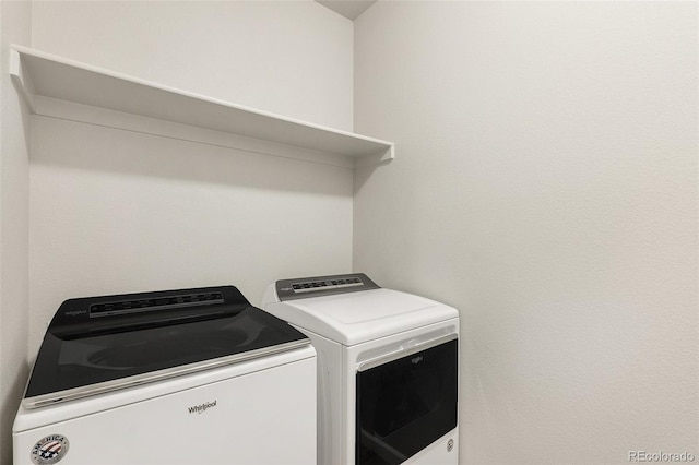 washroom with washer and clothes dryer