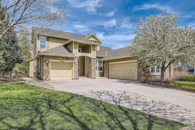 view of front facade featuring roof with shingles, stone siding, a garage, a front yard, and driveway