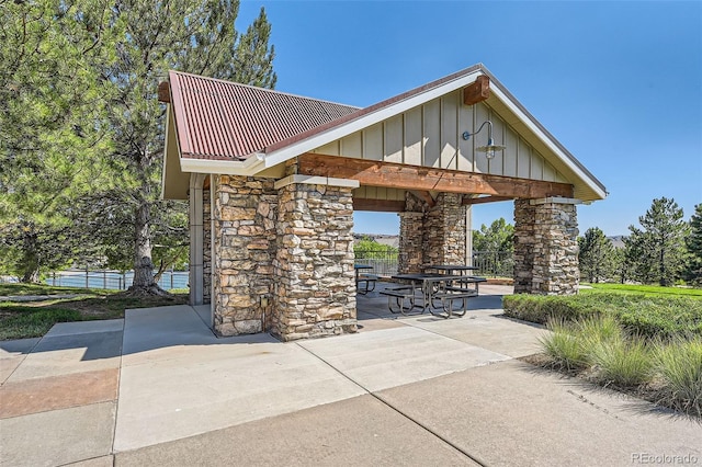 surrounding community with a patio area and fence