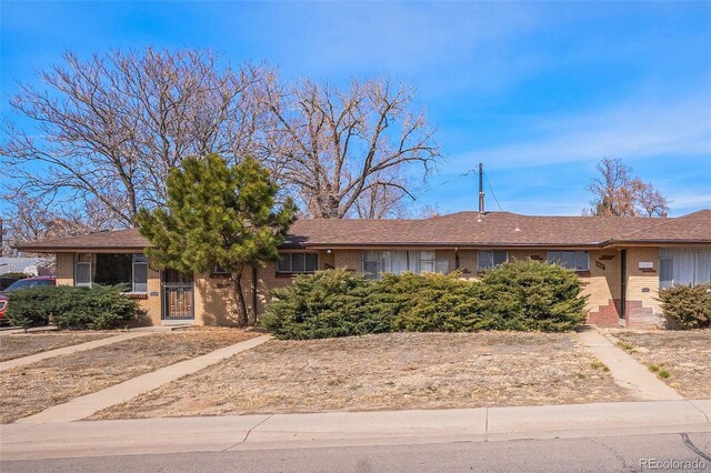 ranch-style house with brick siding