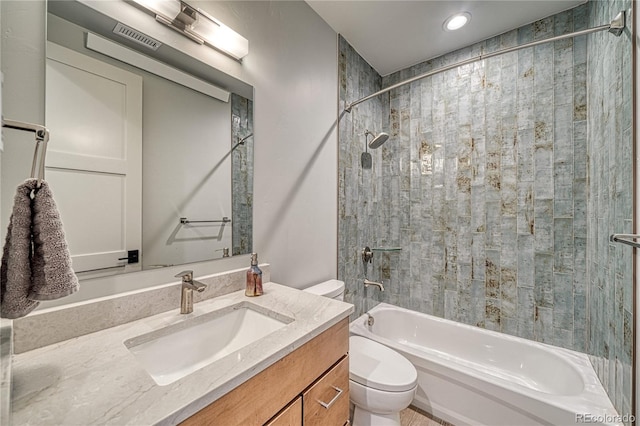 full bath featuring vanity, toilet, and shower / bathtub combination