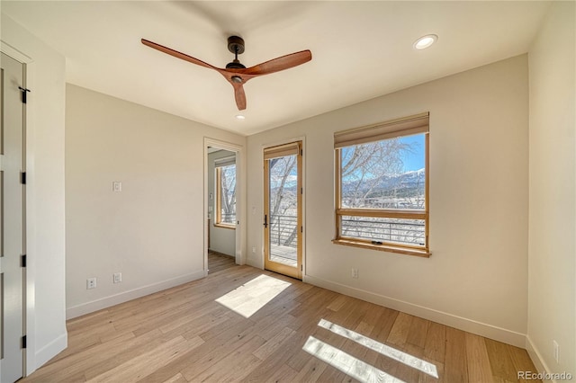 empty room featuring recessed lighting, baseboards, a ceiling fan, and light wood finished floors