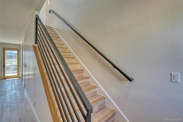 stairway featuring hardwood / wood-style floors