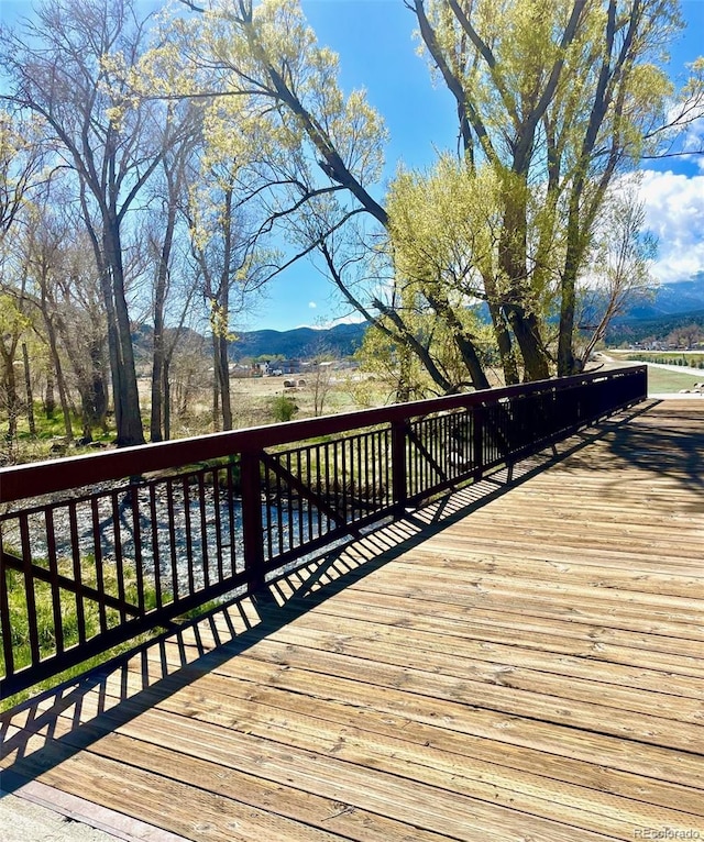 wooden terrace featuring a mountain view