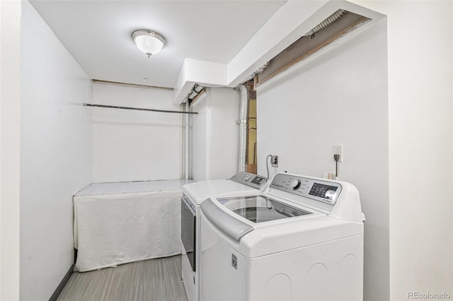 clothes washing area with washer and dryer and laundry area