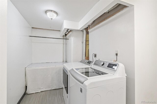 6190 Garrison St, Arvada, CO 80004 - clothes washing area featuring independent washer and dryer and baseboards