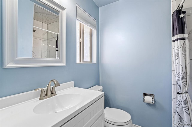 6190 Garrison St, Arvada, CO 80004 - full bath with toilet, vanity, and a shower with shower curtain