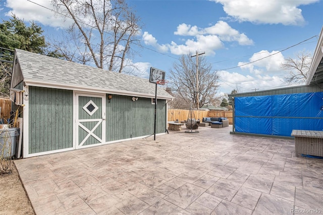 6190 Garrison St, Arvada, CO 80004 - view of patio / terrace with an outdoor structure, an outdoor hangout area, and a fenced backyard